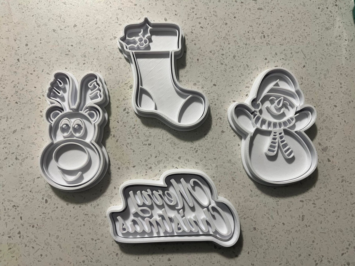 Cookie cutters and stamps with snowman, reindeer and Christmas stocking