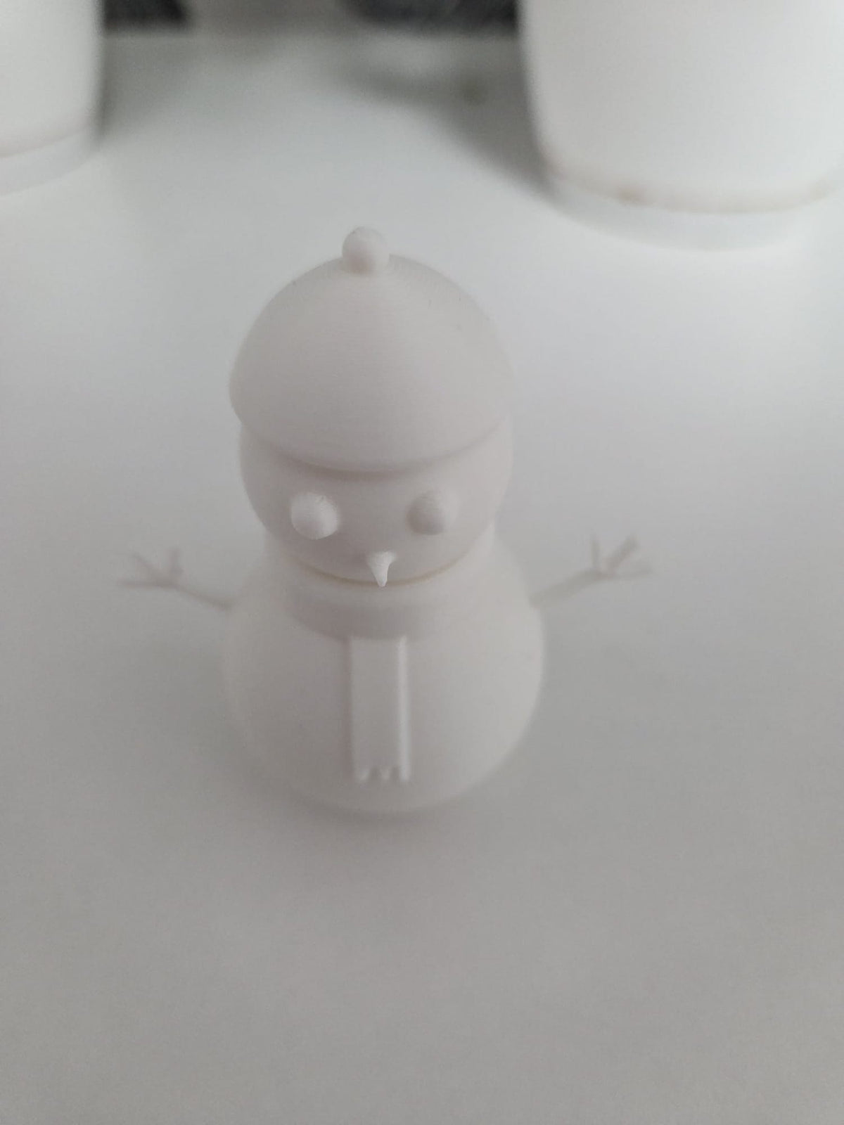 Minimalist smiling snowman figure