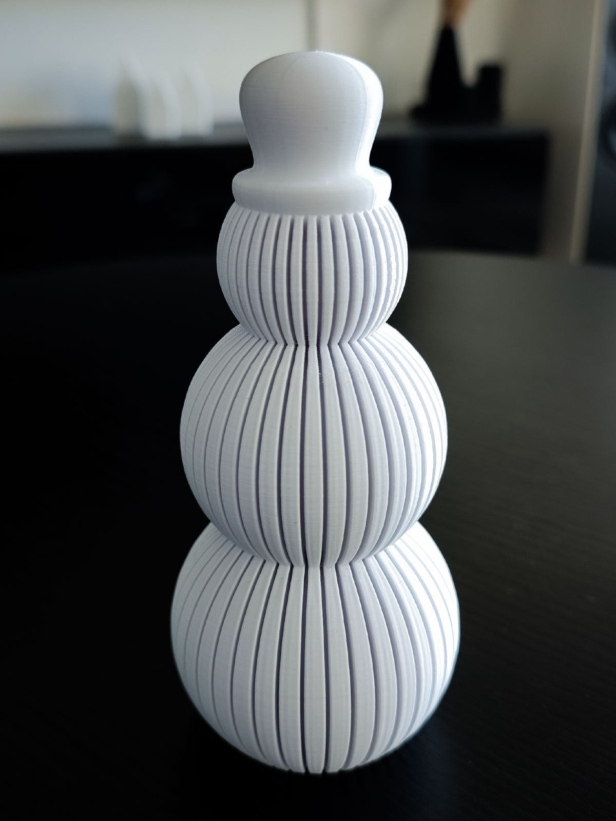 Snowman figure with a ribbed design