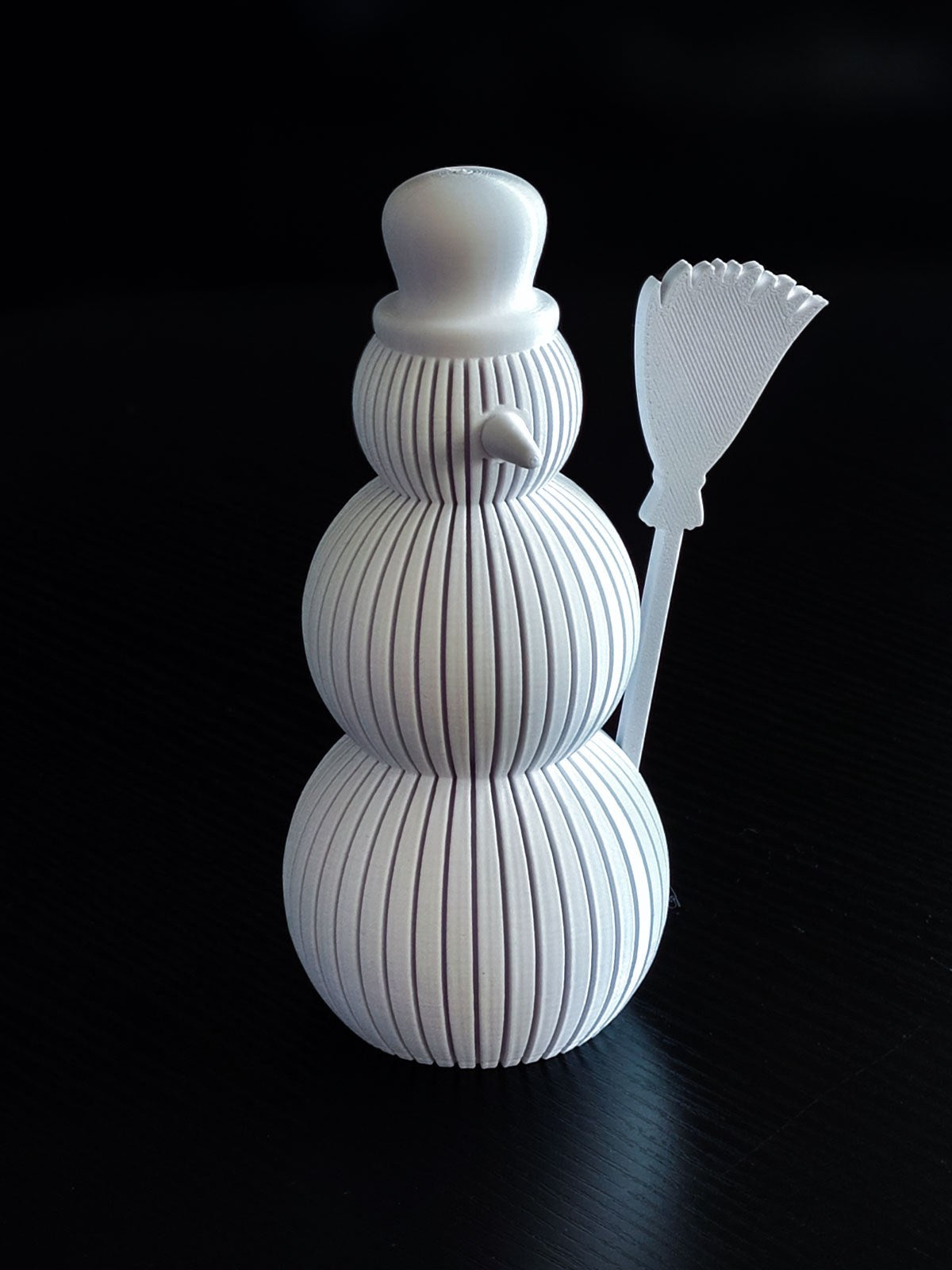 Snowman figure with a ribbed design