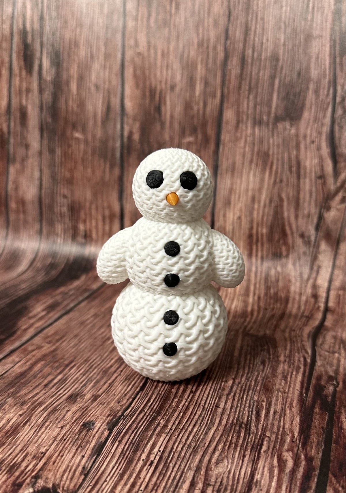 Cute snowman figure with a knitted look