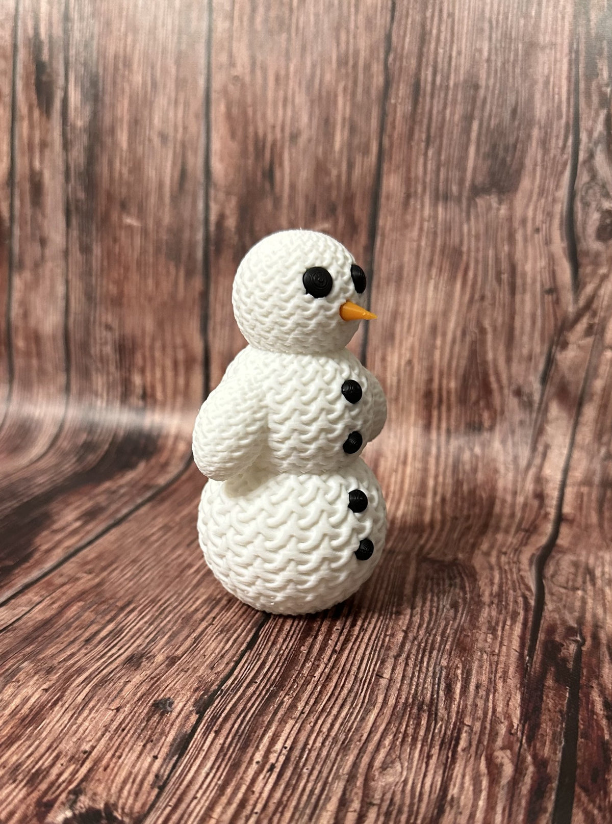 Cute snowman figure with a knitted look