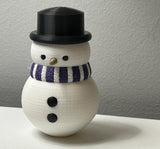 Snowman figure with scarf and top hat